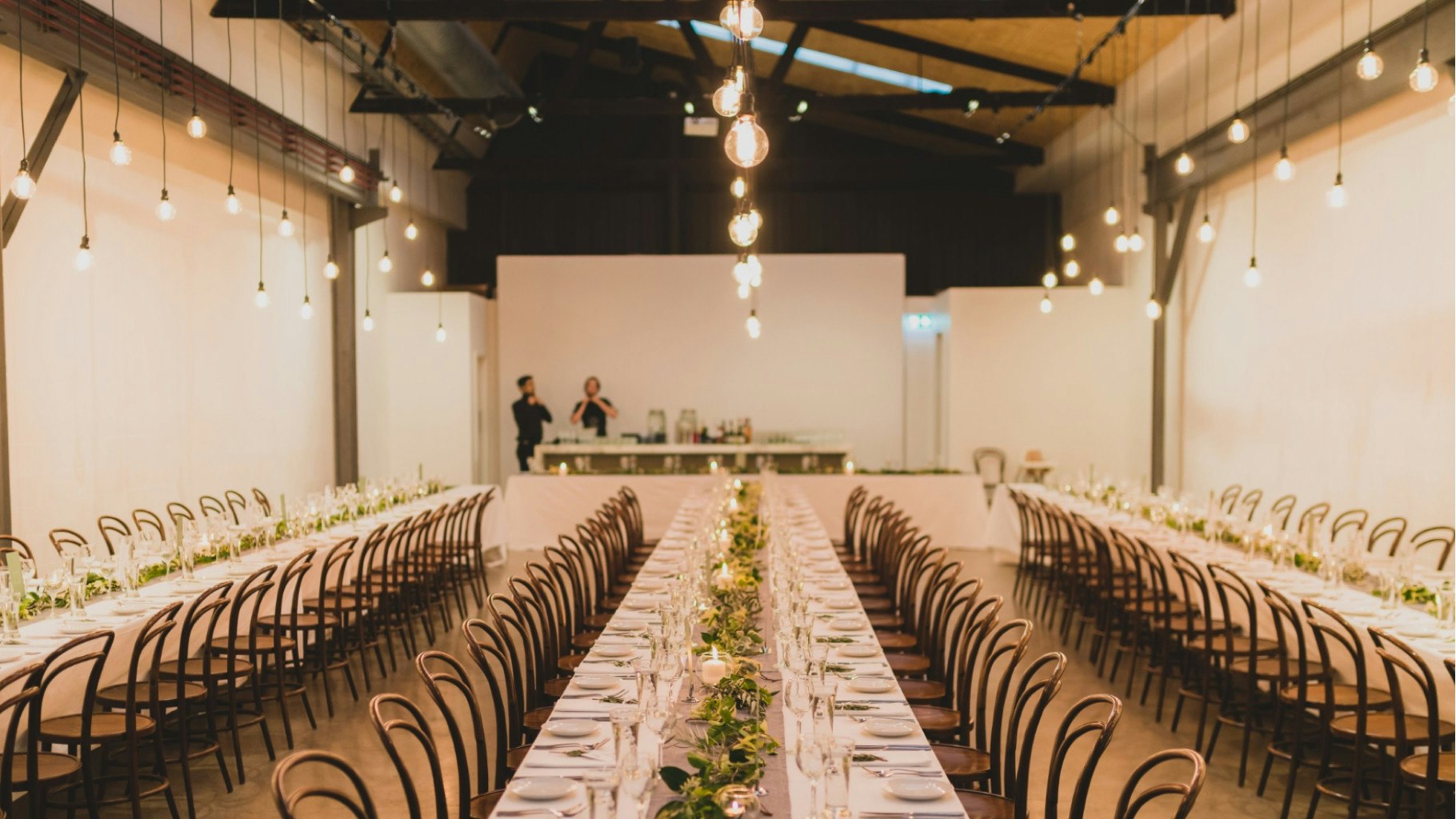 Wedding reception seating and lighting styled.